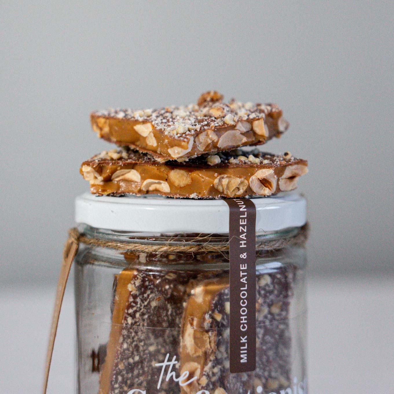 Milk Chocolate and Hazelnut Toffee on top of jar